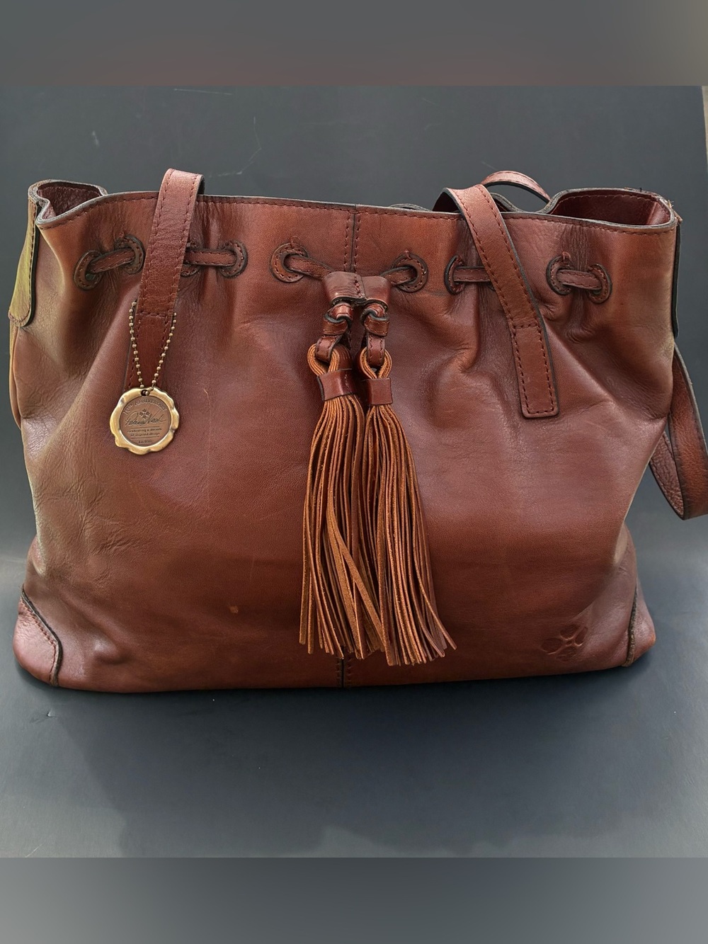 Patricia Nash Chestnut 10 th Anniversary Leather Tassel Drawstring Tote